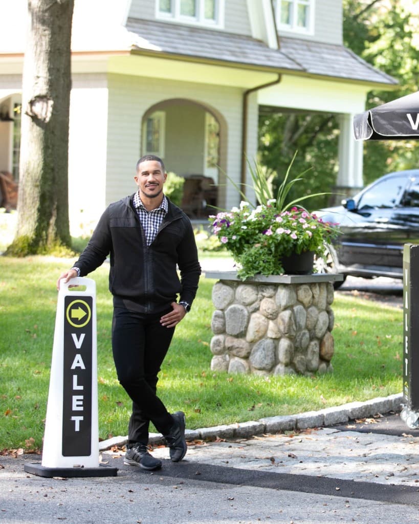 Valet attendant welcoming guests at an upscale event